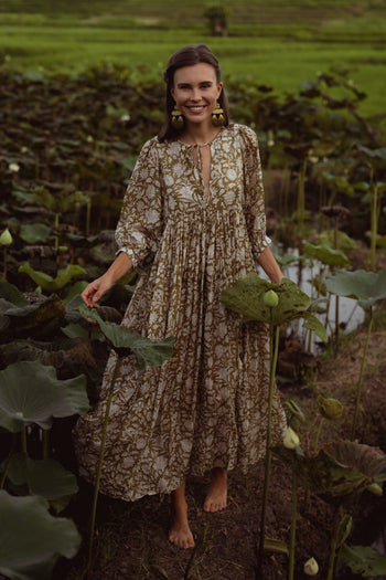Daughters of India Kyra Maxi Dress in Olive — full length smiling in lotus pond, hand screen print cotton